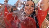 Woman under waterfall with Wet-T-Shirt